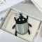 Loewe Beetle Charm In Calfskin Silver